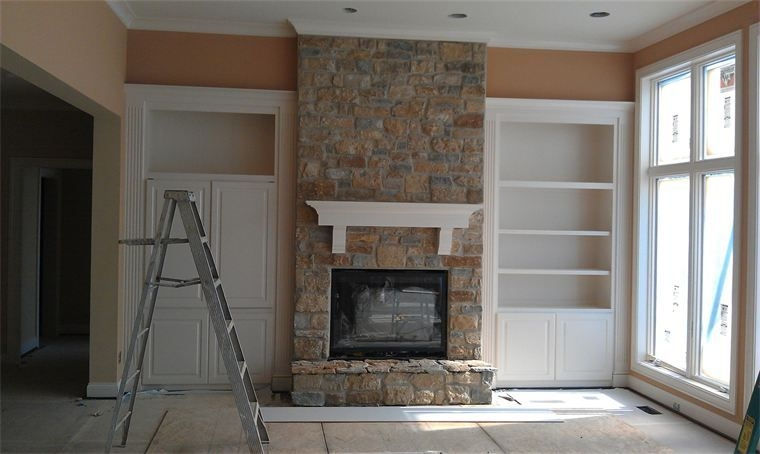 Freshly painted interior living room with stone fireplace